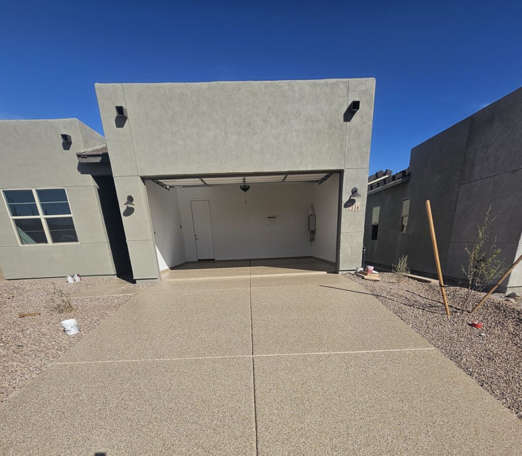 Driveway leading to open garage
